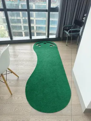 a green rug on the floor in a room at In the City in Manila