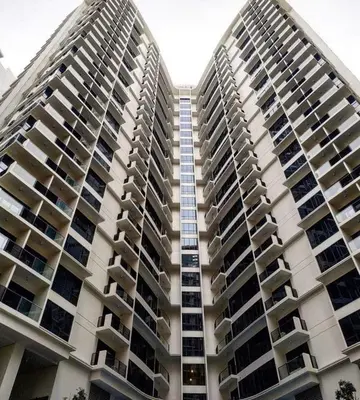 a large apartment building with balconies on it at Morgan Suite Studio a7 next to VeniceCanal Mall Wi-fi in Manila