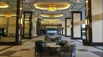a lobby with chairs and tables in a building at Torre De Manila in Manila