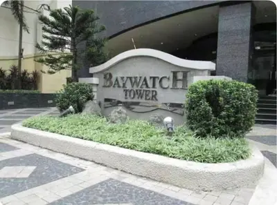 a sign for a baywatch tower in front of a building at Seaview in Malate in Manila