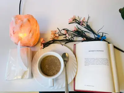 a book and a cup of coffee and a pastry at Seaview in Malate in Manila