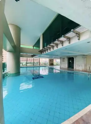 a large swimming pool in a large building at Seaview unit in Manila