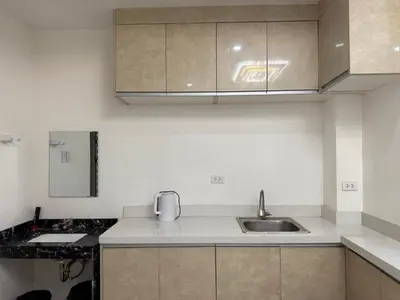 a kitchen with a sink and a counter top at JCAL Building Next to Manila Aiports Okada, Solaire MOA in Manila