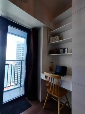 a room with a desk with a laptop and a window at Comfortable & Peaceful for You #4806 in Manila