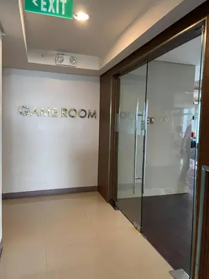 an entrance to a game room with a glass door at FX Property 3926 in Manila