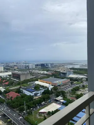an aerial view of a city with traffic and buildings at FX Property 3926 in Manila