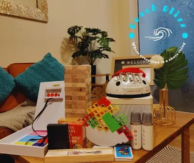 a coffee table with books and a telephone on it at SM Bicutan Miami in Manila