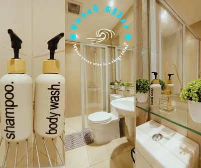 a bathroom with two large bottles of water in it at SM Bicutan Miami in Manila