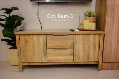 a wooden cabinet with a sign that reads gift rest q at Stylish Condo with Free Wifi & Netflix, Near Airport HMS3 in Manila
