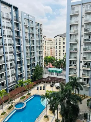 an overhead view of a swimming pool with buildings at Studio Unit in One Palm Tree Villas across NAIA Terminal 3 in Manila