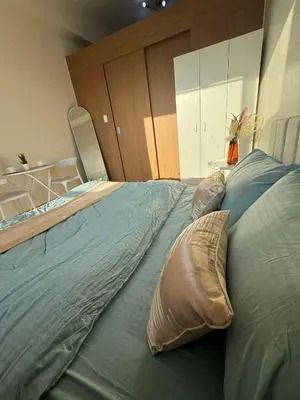 a large bed with two pillows on top of it at Casa Aotea in Sampong
