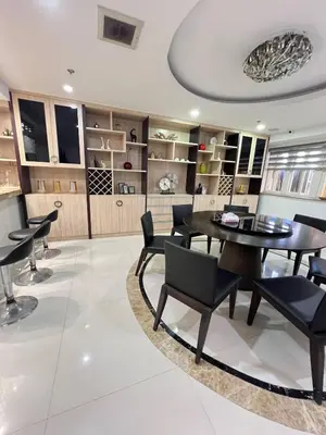 a dining room with a table and chairs at R&R Empire Rental Unit in Manila