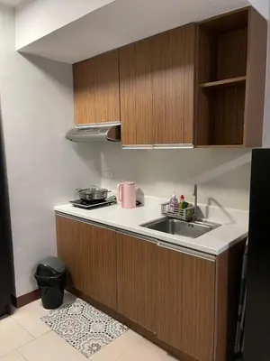 a small kitchen with a sink and a stove at Makati City Antel Spa Residences 2306 in Manila