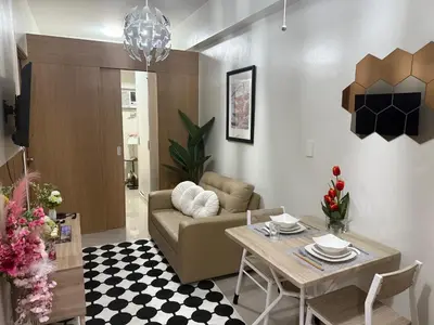 a living room with a couch and a table at Modern japan home in the Philippines in Manila