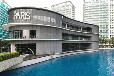 a building with a pool of water in front of it at 1BR Condotel at Azure Urban Resort Near Airport #AZ07 in Manila