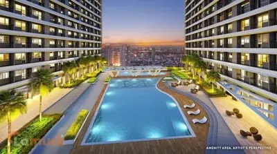 an overhead view of a large building with a swimming pool at KakaI's Staycation in Fame in Manila