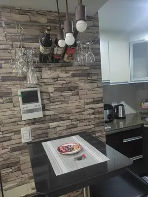 a kitchen with a counter with a plate on a table at LDN Staycation Booking partners in Manila