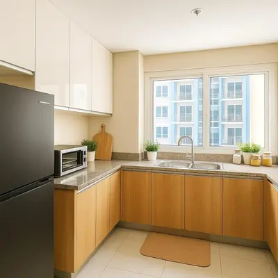 a kitchen with a sink and a microwave at Modern & Luxury 1BR near Okada, Solaire, Airport in Manila