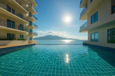 a swimming pool in the middle of a building at Modern & Cozy 3BR near Okada, Solaire, Airport in Manila