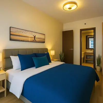 a bedroom with a blue and white bed in a room at Modern & Cozy 6BR near Okada, Solaire, Airport in Manila