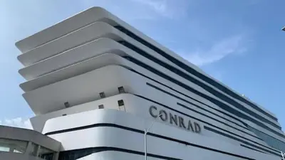 a white building with the name camland on it at Sybaysuites staycation near Okada COD MOA NAIA airport Solaire MSV1808H in Manila
