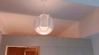 a light hanging from a ceiling in a room at 1BR Condotel with Balcony at SM Light Residences #LT04-1 in Manila