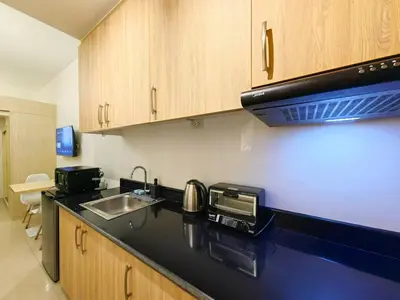a kitchen with a sink and a counter top at 1BR Condotel with Balcony at SM Light Residences #LT05-1 in Manila