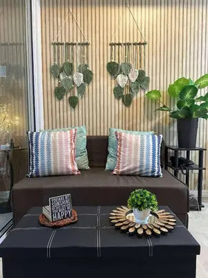 a living room with a couch and a table at AZURE BICUTAN-MAUI 1631 City View in Manila