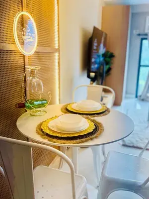 a table with two plates on top of it at Netflix and WiFi Staycation Viceroy Walk to Venice Grand Canal in Manila