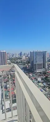 a view of the city from the top of a building at Coast Residences in Manila