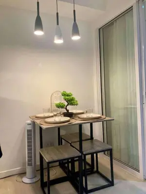 a table with a plant on it in a room at 1BR Condotel in Azure Urban Resort Near NAIA #TRO3 in Manila