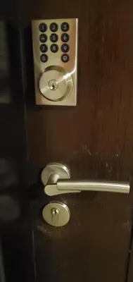 a close up of a bathroom door with a remote control at 81 Newport Studio C5 5i near NAIA T3 Pool and Balcony in Manila