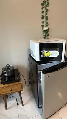 a microwave sitting on top of a table at AyenStaycation in Manila