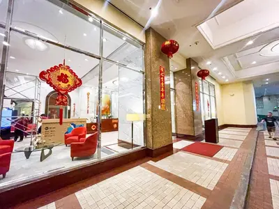 a lobby with red chairs and a large window at Elegant 2BR Manila Bay Sunset near US Embassy in Manila