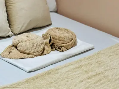 a white bed with two towels on top of it at Shore 2 Residences Room 360 POOL VIEW by Prime Stay MOA in Manila