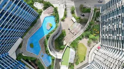 an aerial view of a park between two tall buildings at Home with Best Sunset of Manila Bay and Sea view! in Manila