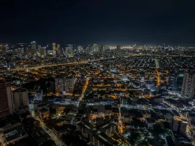 an aerial view of a city at night at Home with Best Sunset of Manila Bay and Sea view! in Manila