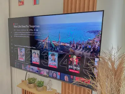a large flat screen tv hanging on a wall at The Sandscape Suite in Manila