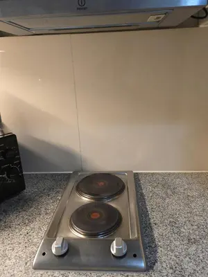 a stove top with two burners on a counter at BGC Uptown Parksuites Cosy 1 Bedroom Suite with balcony 300MBPS wifi in Manila