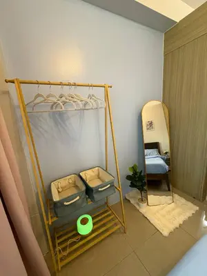 a room with two bunk beds and a surfboard at Azul Paradise in Manila