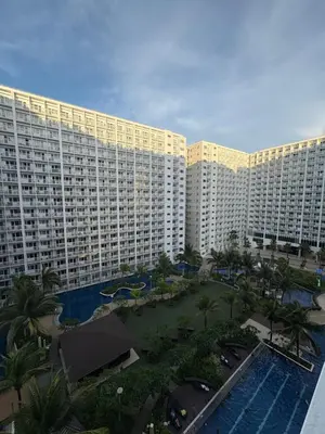 an aerial view of a large apartment building with a pool at Azul Paradise in Manila