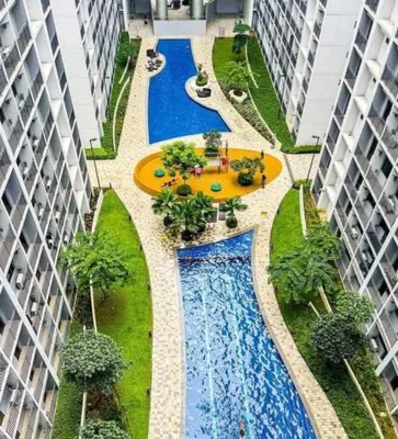 an overhead view of a swimming pool between two buildings at Staycation in Shore Residences, walking distance to MOA and near Manila Airport in Manila