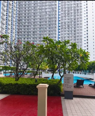 a red carpet in front of some tall buildings at Condotel or apartment SM JAZZ RESIDENCES in Manila