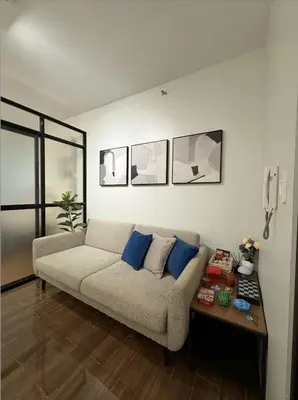 a living room with a couch and a table at Solace Haven in Manila