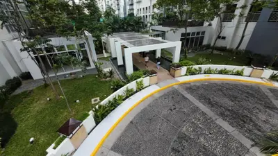 an overhead view of a building with a road at Kasara Urban Resort Elly's Pad with balcony in Manila