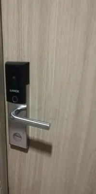 a close up of a door with a metal handle at Larsie's Place in Manila