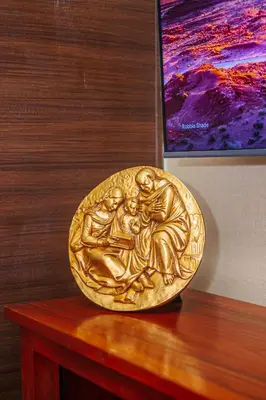 a gold object sitting on a wooden table at AIR Residence Wondeful Condo Ayala Ave 1703 Central Makati Swim Gym in Manila