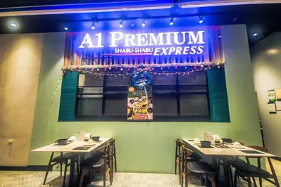 a restaurant with two tables and a sign on the wall at AIR Residence Wondeful Condo Ayala Ave 1703 Central Makati Swim Gym in Manila