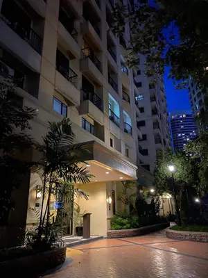 a building at night with a street in front at BGC Condominium Near St Luke Fort Bonifacio Taguig in Manila