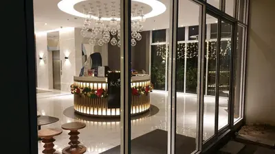 a room with a chandelier in a building at Condo Free Pool Fast Wi-fi near BGC, C5 in Manila